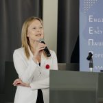 Marina speaking in a conference